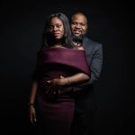 Couple posing for photo in studio.
