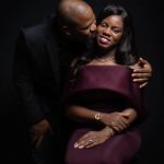 Couple posing for photo in studio.