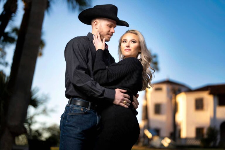 Couple posing for photo at sunset.