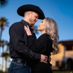 Couple posing for photo at sunset.