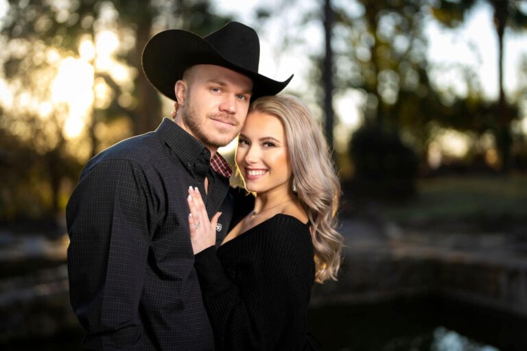 Couple posing for photo at sunset.