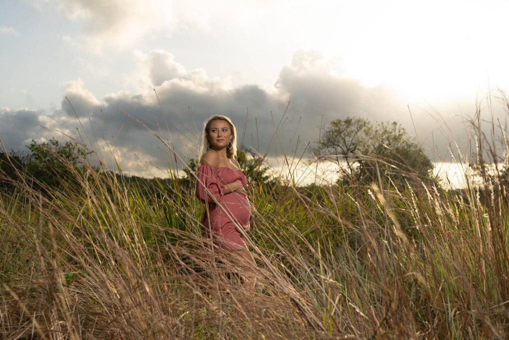 Pregnant woman in a field.