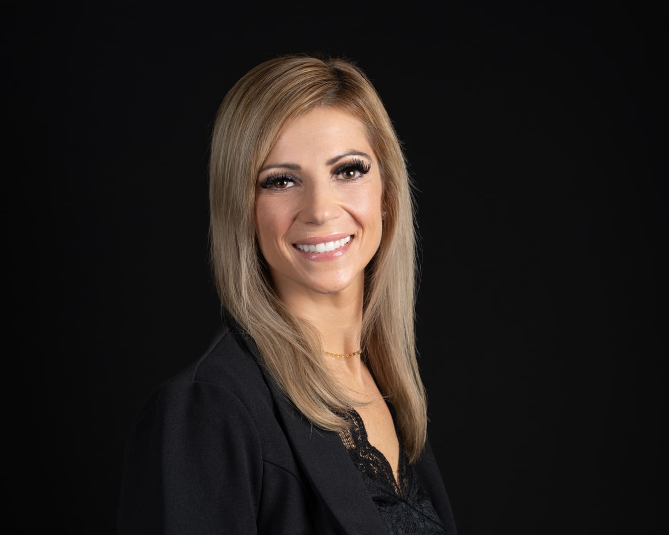 Female smiling for headshot.