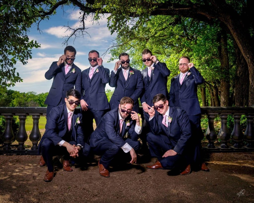 Groomsmen pose for photo.