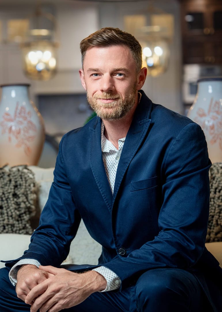 Man posing for headshot.