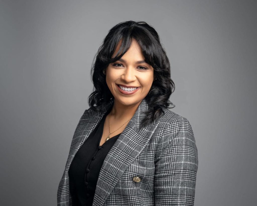 Woman posing for headshot.