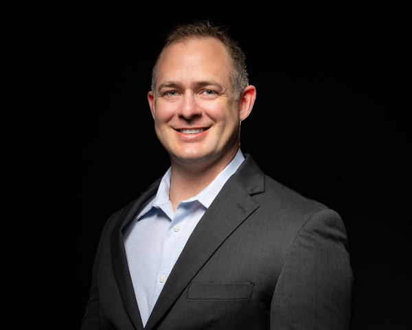 Man in suit posing for headshot