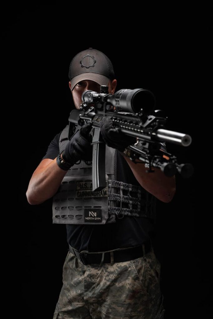 Man aiming rifle.