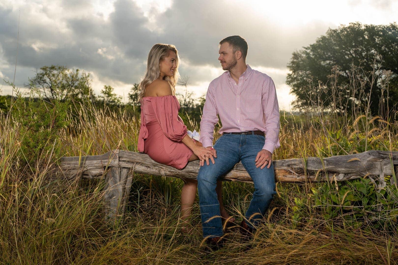 Couple posing for photo at sunset.