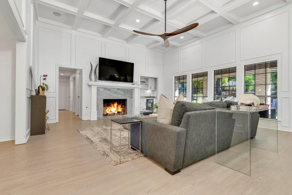 Nice living room with a fire in fireplace.