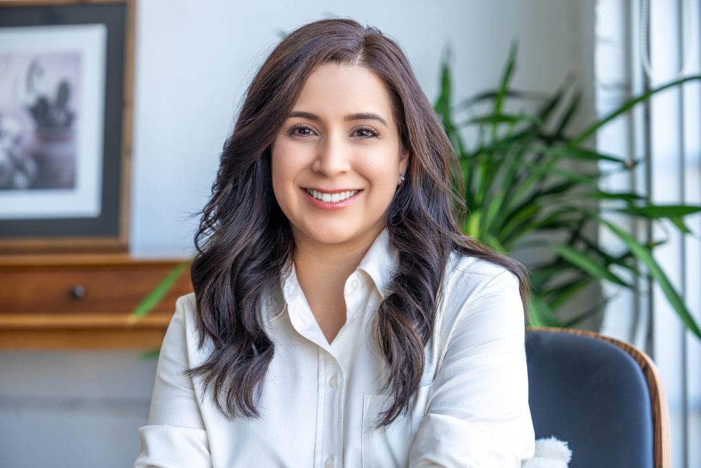Woman posing for headshot.