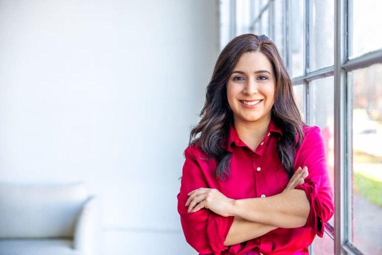 Woman posing for headshot.