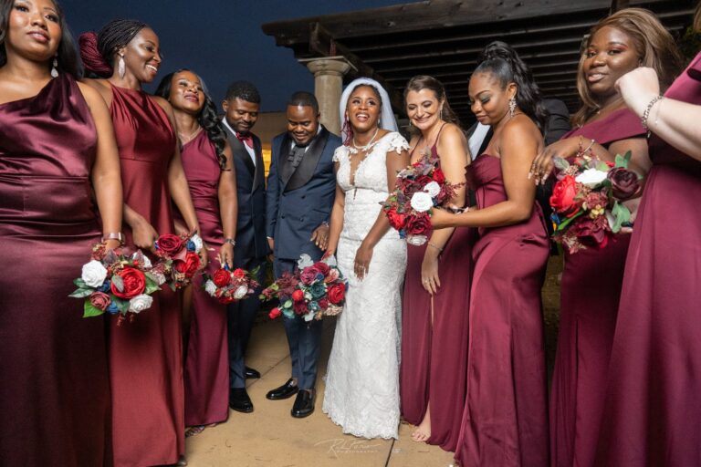 Wedding party standing in a semi-circle.
