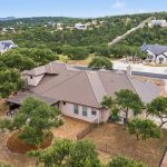 Aerial drone photo of a Texas Hillcountry home.
