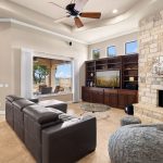 Nice home living room with a fire in the fireplace.