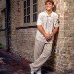 You man posing for senior photos.