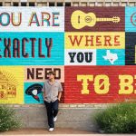 You man posing for senior photos in The Pearl District in San Antonio.