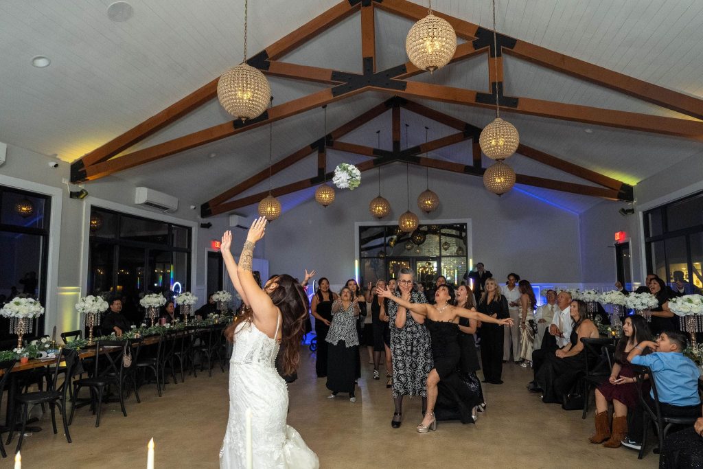 Bride throwing the bouquet .