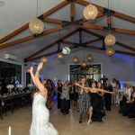Bride throwing the bouquet .