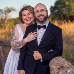 Couple posing for engagement photos outdoors