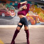 Beautiful girl posing in front of graffiti