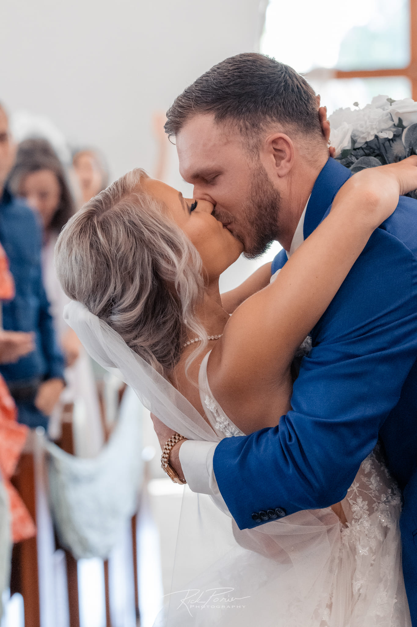 Bride and groom kissing.